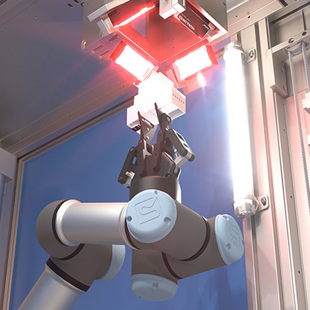 Robotic gripper arm holds DIN rail housing in front of a laser lens with vision system