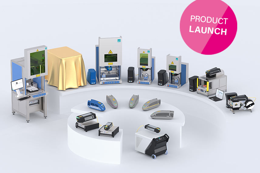 ACI Lasersysteme zur AMB 2026 mit verhüllter Neuheit unter goldenem Tuch und Product Launch