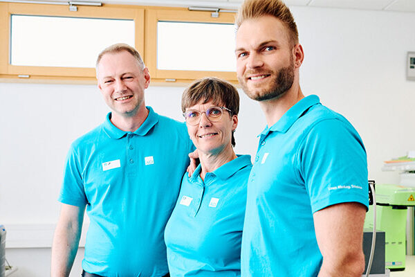Three satisfied-looking members of the ACI team